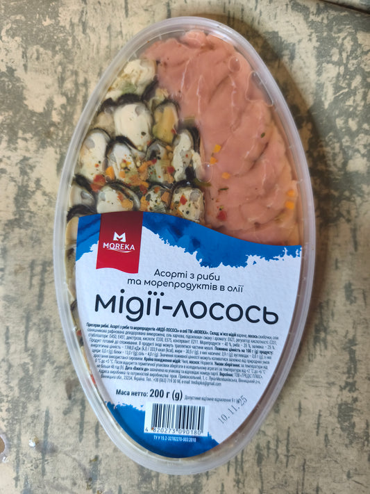 Пресерва мідії + лосось 200г.Ціна не включає 20% обов'язкового пожертвування на Парасольку. Пожертвування потрібно додати під час оформлення замовлення. Дякуємо за вашу підтримку!